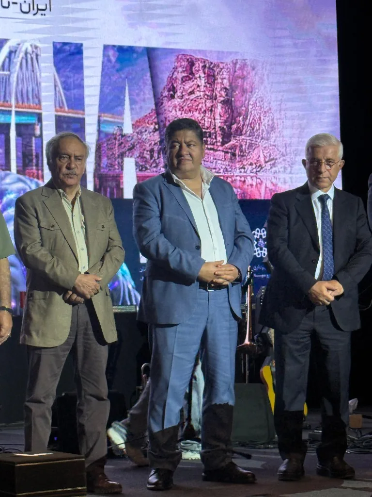 Prof. Guive Sharifi on stage with colleagues during the congress awards programme